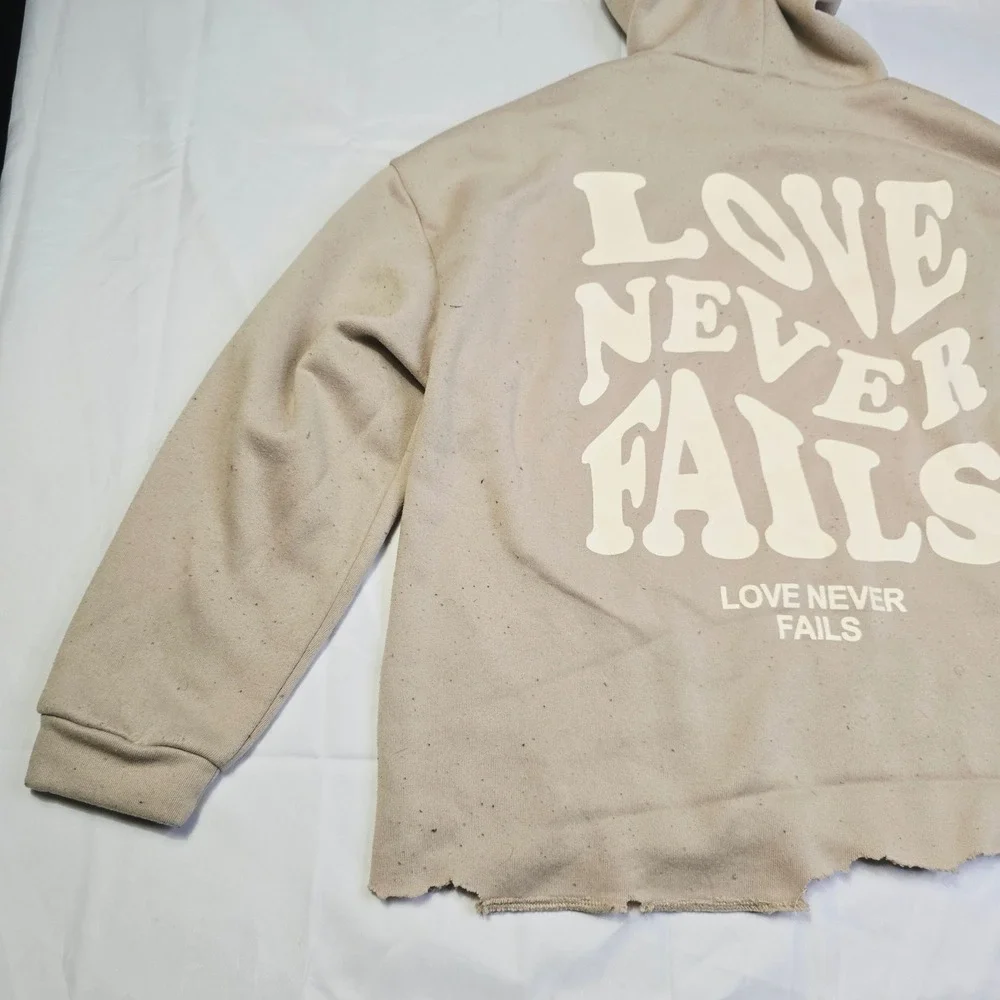 Men's Love Never Fails Fleece Hoodie Size M Beige Distressed Raw Hem T3